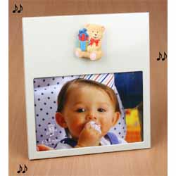 A Musical frame with a teddy bear design  simply turn the teddy bear to hear \Twinkle Twinkle